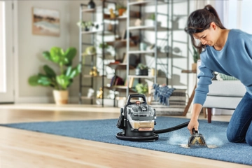 Using Little Green HydroSteam to deep clean stain on area rug. 