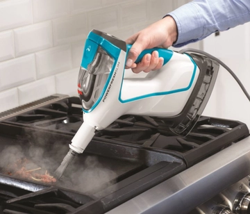 Using Hand Steamer with tool to steam kitchen stove