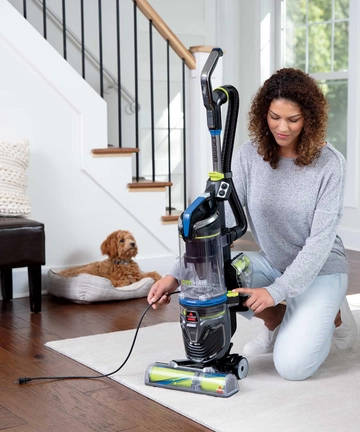 Rewinding Cord back into Pet Hair Eraser Tubo Rewind Vacuum Cleaner.