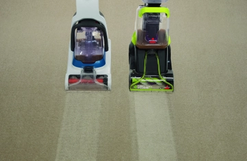 TurboClean PowerBrush Carpet Cleaner next to competitor carpet cleaner deep cleaning carpet.