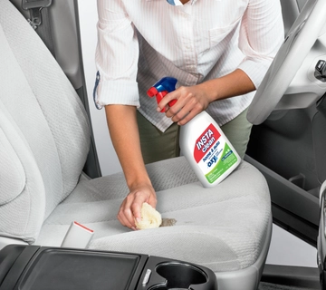 INSTAclean Stain & Odor Remover being used to remove stain off car upholstery.
