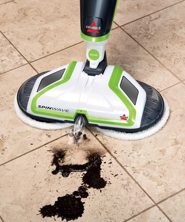 SpinWave Spin Mop Spraying mess on tile flooring.