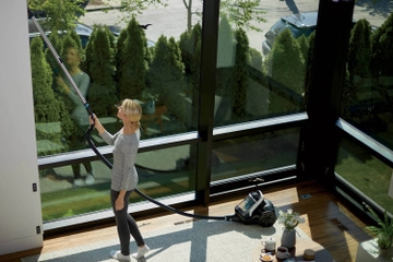 Using Pet Hair Eraser Canister Vacuum to vacuum above flooring