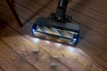 Headlight feature vacuuming hair and dirt from hard flooring