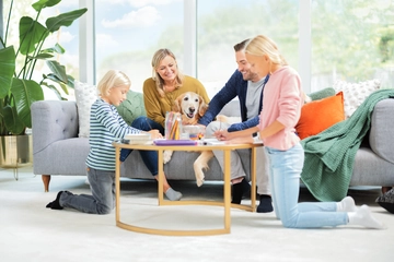Family and dog in living area.