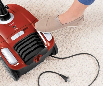 Rewinding cord back into Zing Bagged Canister Vacuum