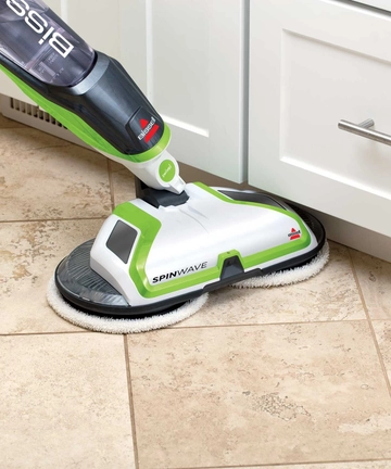 SpinWave Spin Mop mopping along baseboards under cabinets