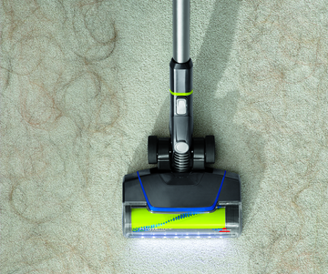 CleanView Pet Slim Cordless Stick Vac Vacuuming up pet hair from carpet. 