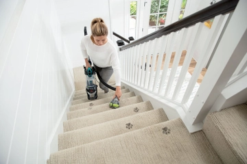 Using Pod of MultiClean Allergen Lift Off to vacuum stairs