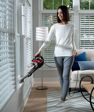 Using Hand Vac with Dusting Brush to clean sills.