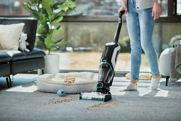 CrossWave Cordless Max Wet Dry Vac Vacuuming area rug.