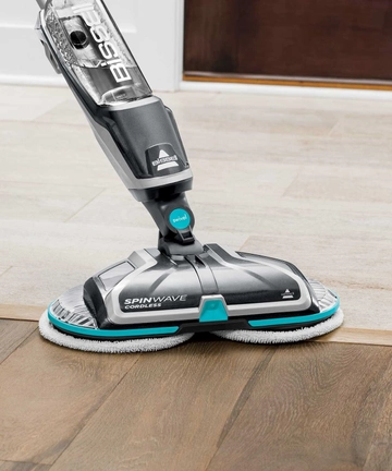 SpinWave Cordless Spin Mop switching between tile and hard floors.