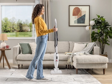  Holding FeatherWeight Stick Vac to add floor nozzle