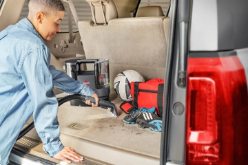 Using Little Green Cordless Smartmix to deep clean inside car interior