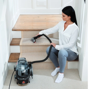 Using SpotClean Pro Portable Carpet Cleaner to deep clean stairs.