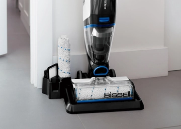 CrossWave Cordless Max Multi-Surface Wet Dry Vac on storage cleaning try with brush roll in holder. 
