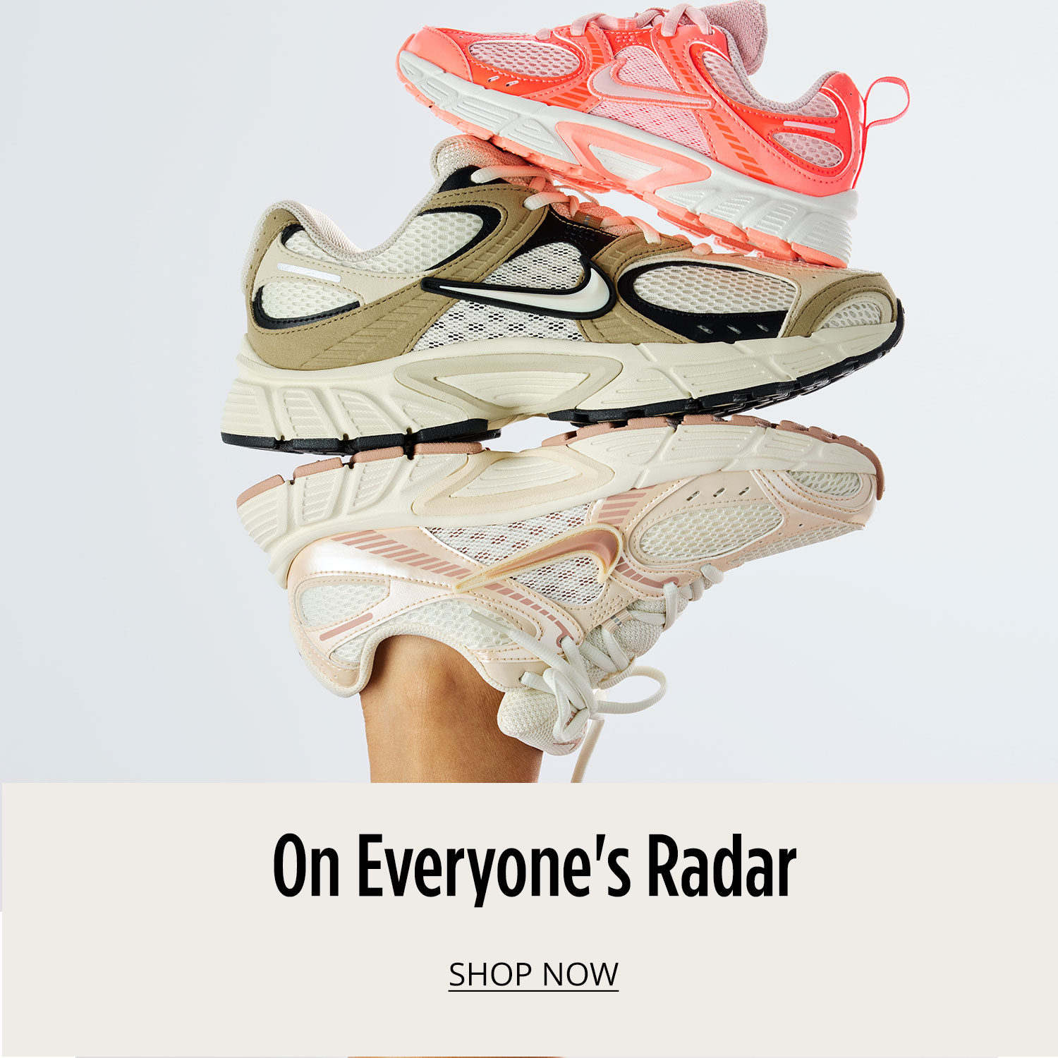 2 women's Nike sneakers stacked on top of another sneaker that's on a foot saying On Everyone's Radar