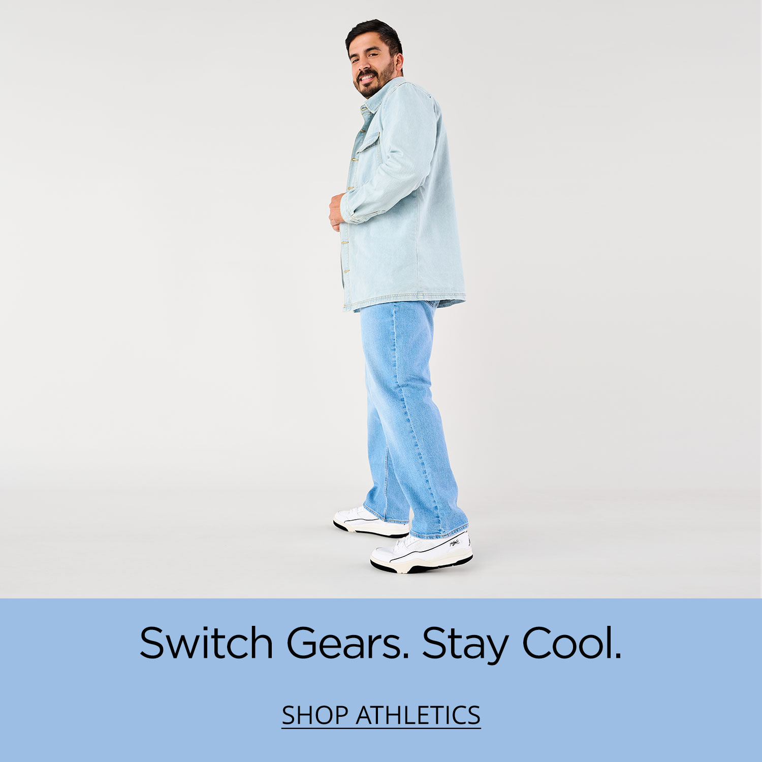 A dad crouching forward, smiling and showing off his new Brooks Anthem 7 running shoes.