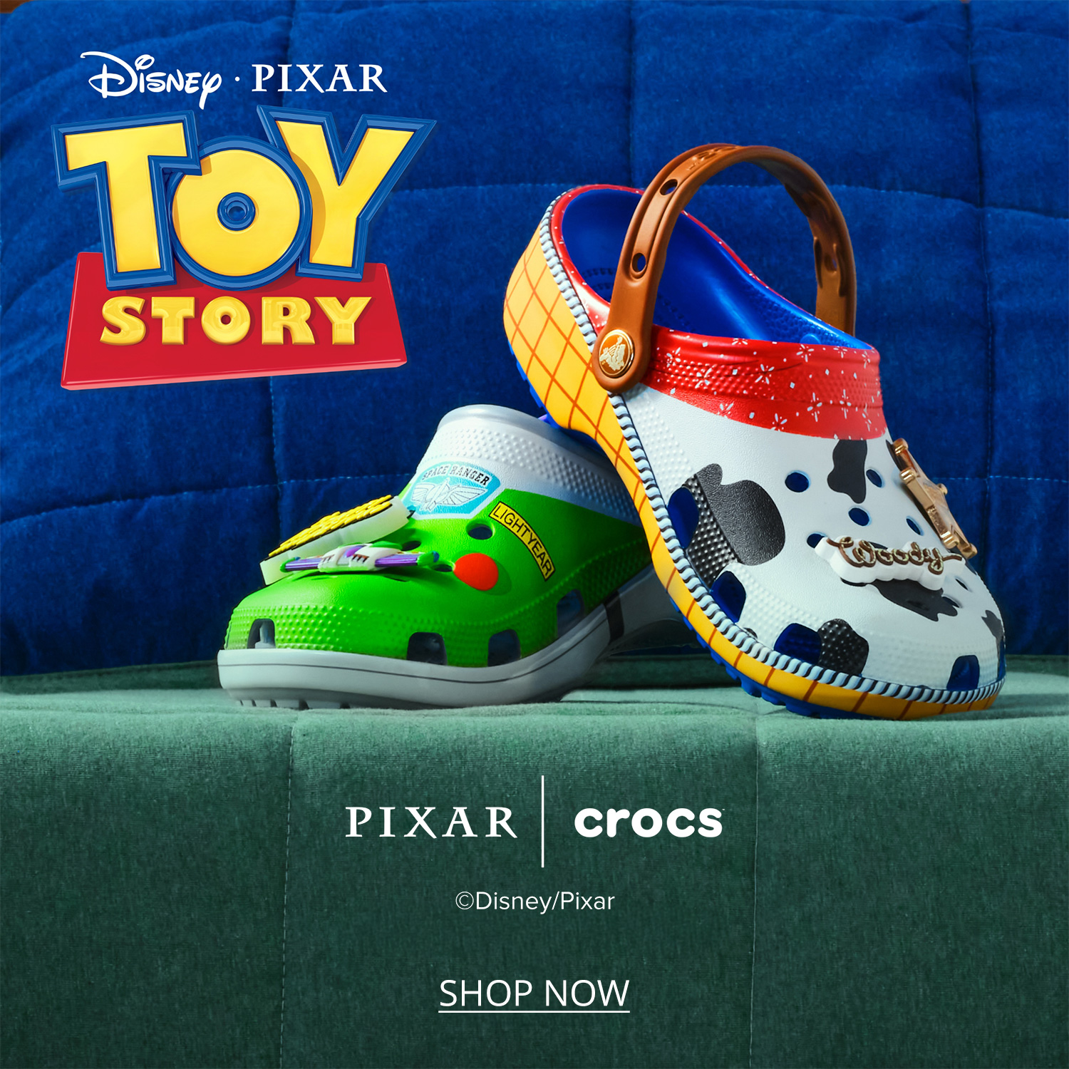 A pair of Pixar Toy Story themed Crocs against a blue and green couch background, A Woody and Buzz Themed Crocs