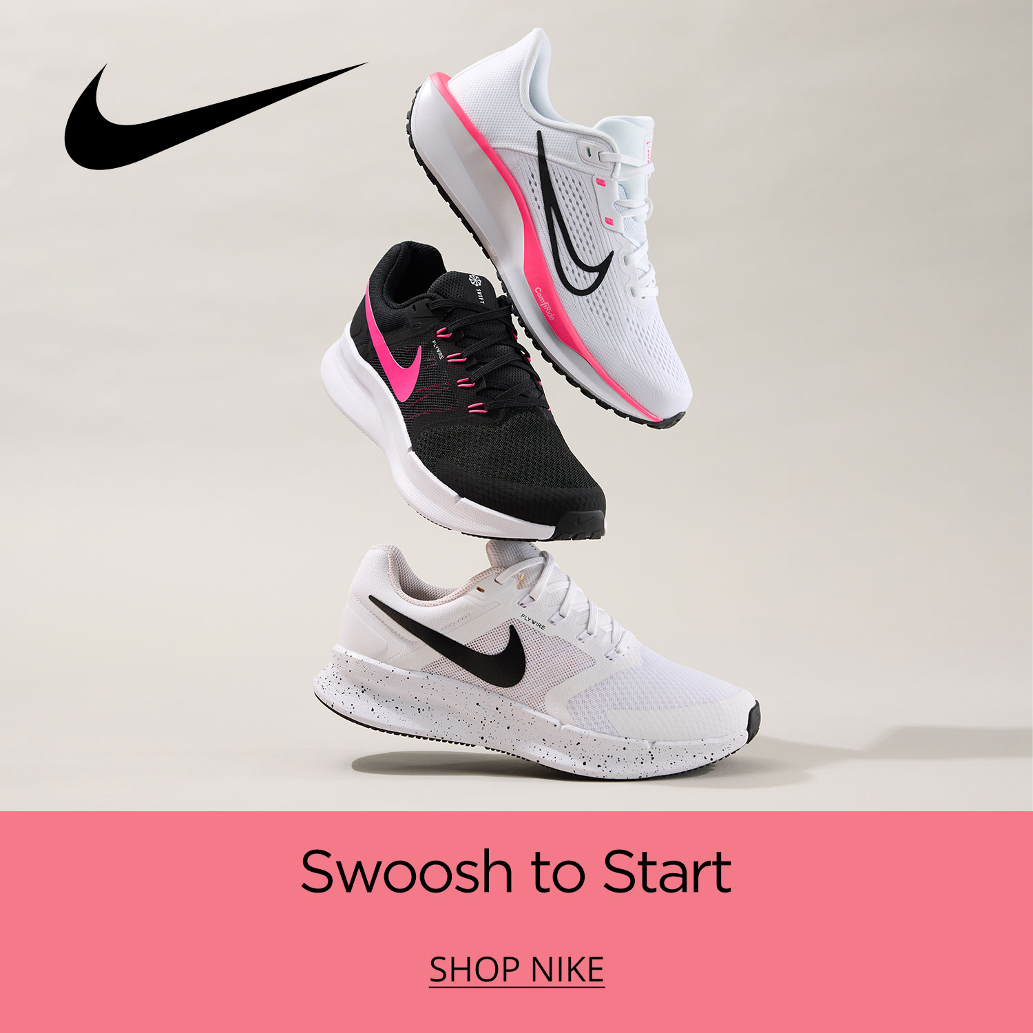 Three casual Nike running shoes stacked carefully and tastefully on top of each other against a soft white background.