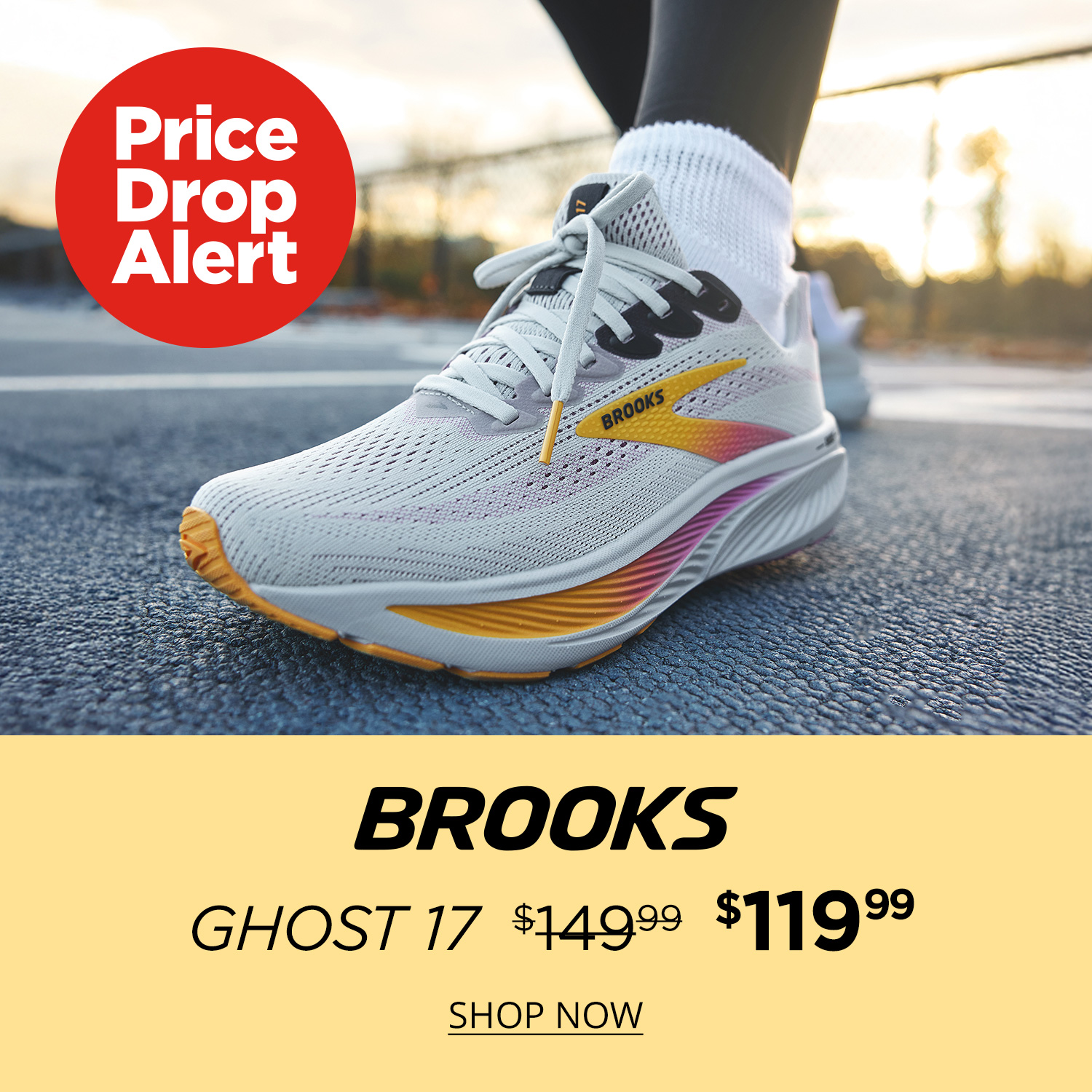 Focus lifestyle shot on the Brooks Ghost 17 on the foot of a person standing on n outdoor track on a dewy morning.