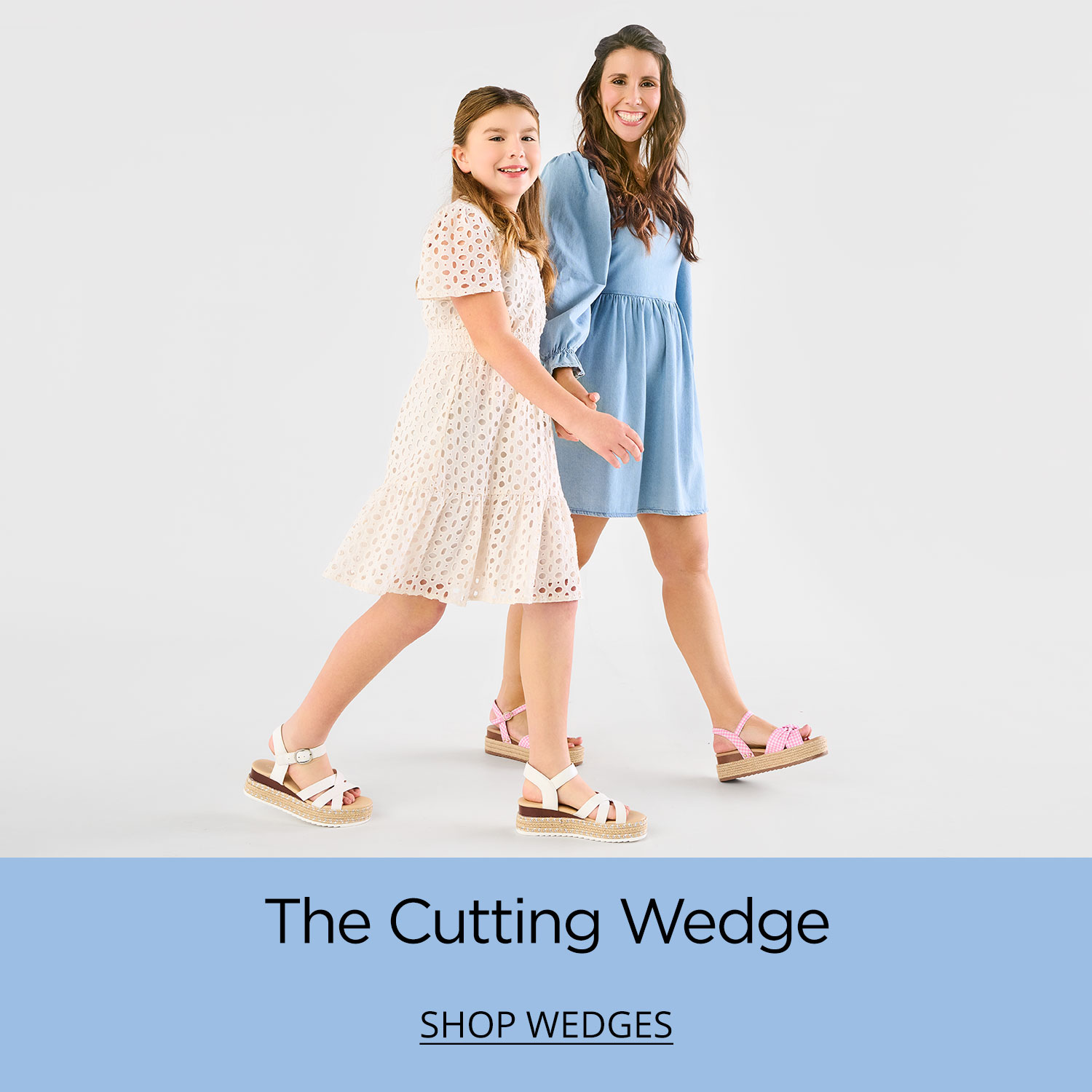 A mom and her daughter walking comfortably in their sandal wedges on their way to school and work.