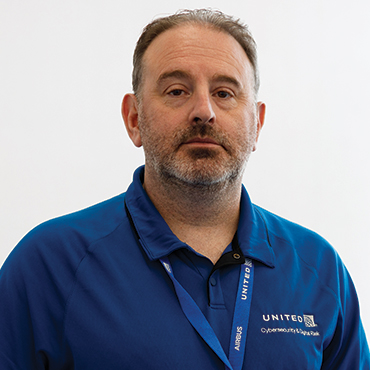 Headshot of John Gianopulos