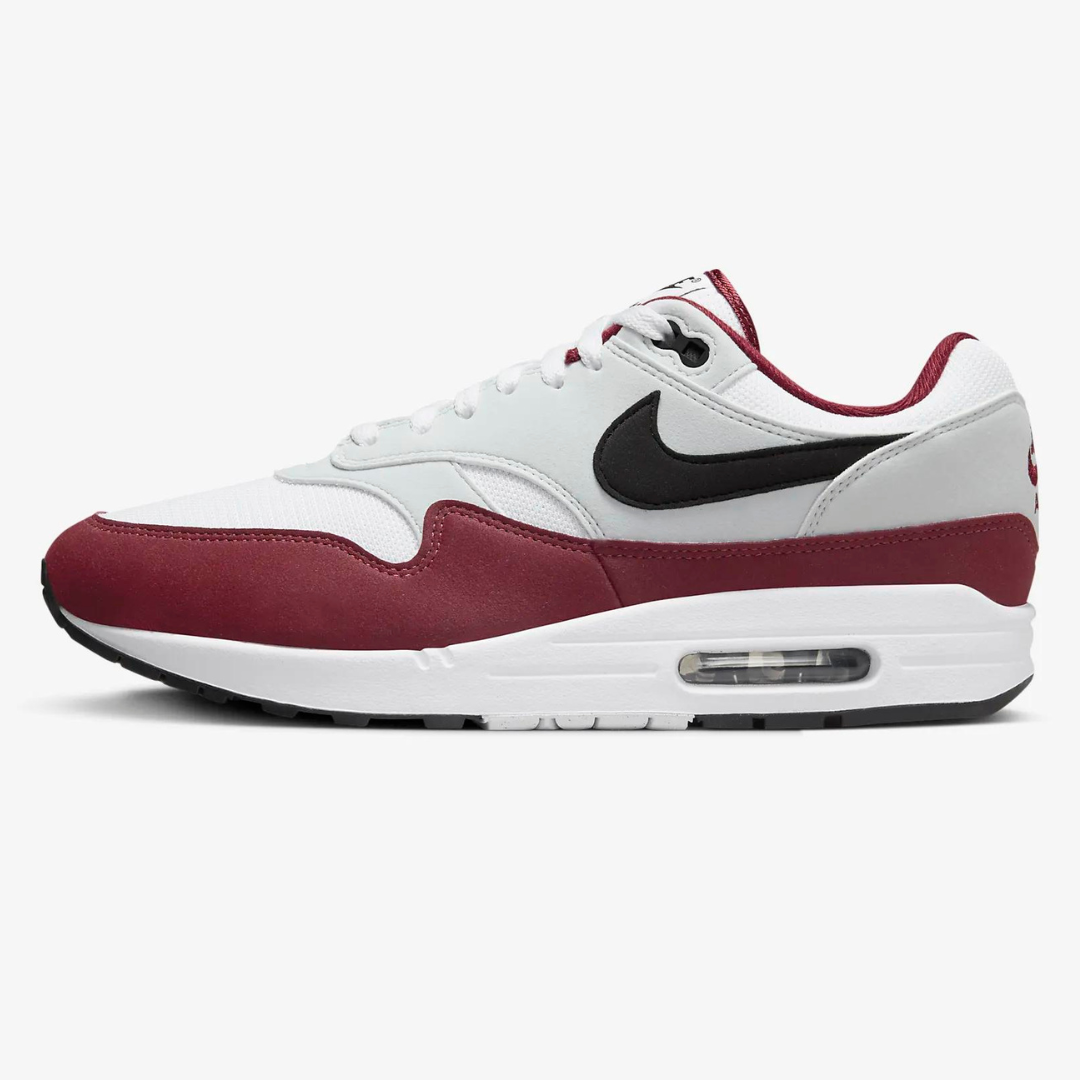 White and burgundy sneakers with a black Nike swoosh logo.