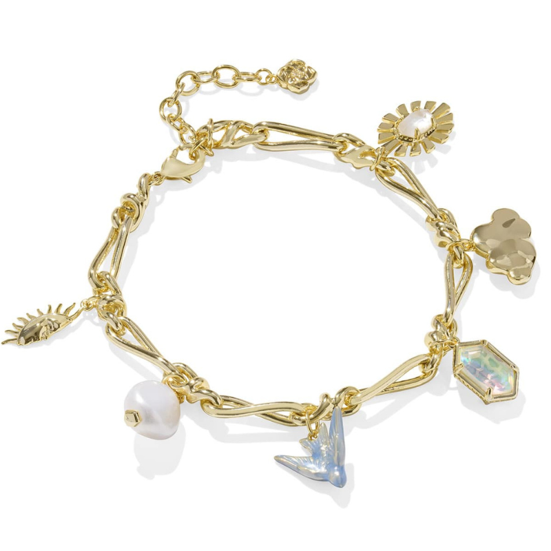 A gold charm bracelet featuring various pendants, including an eye, sun, pearl, bird, and gemstone-like shapes, connected by twisted links.