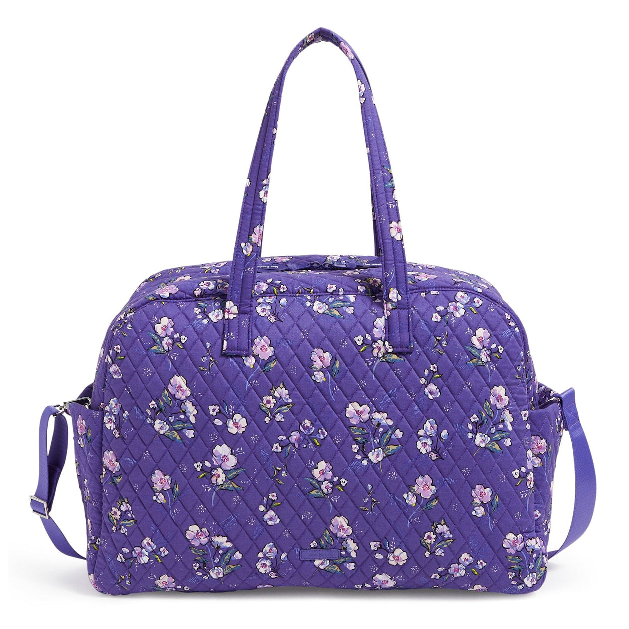 Purple quilted Vera Bradley Outlet Traveler Bag with a floral pattern, featuring two top handles and an adjustable shoulder strap.