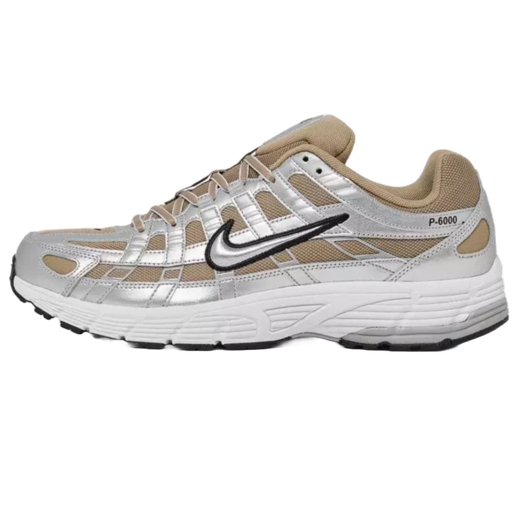 Nike Men's P-6000 Shoes feature a retro-inspired design with a combination of silver and beige mesh and synthetic overlays, a textured black Swoosh logo, and a cushioned white midsole for comfort.