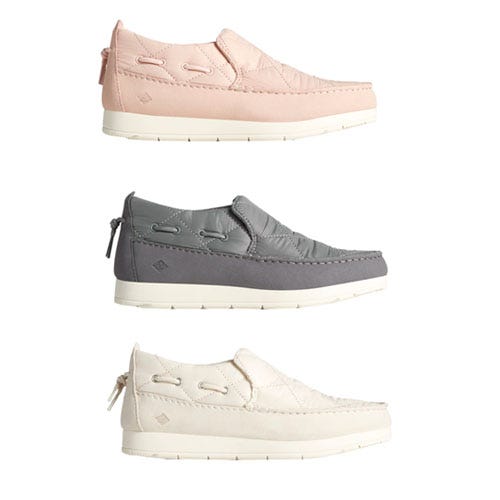 Three pairs of boat shoes in pink, gray, and white colors.