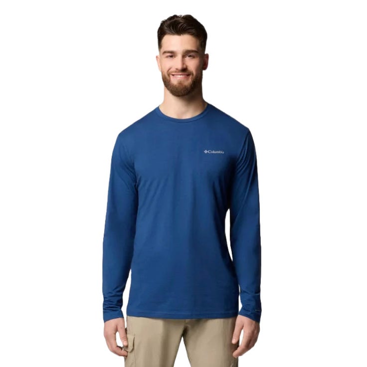 A man is wearing a blue Columbia long-sleeve shirt with khaki pants.