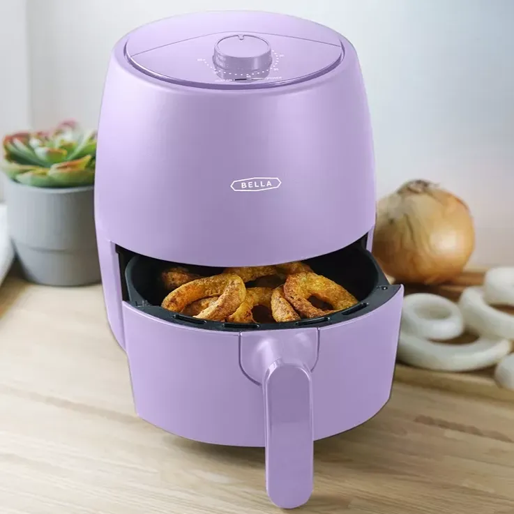 A Bella air fryer with potato wedges inside, placed on a kitchen counter.