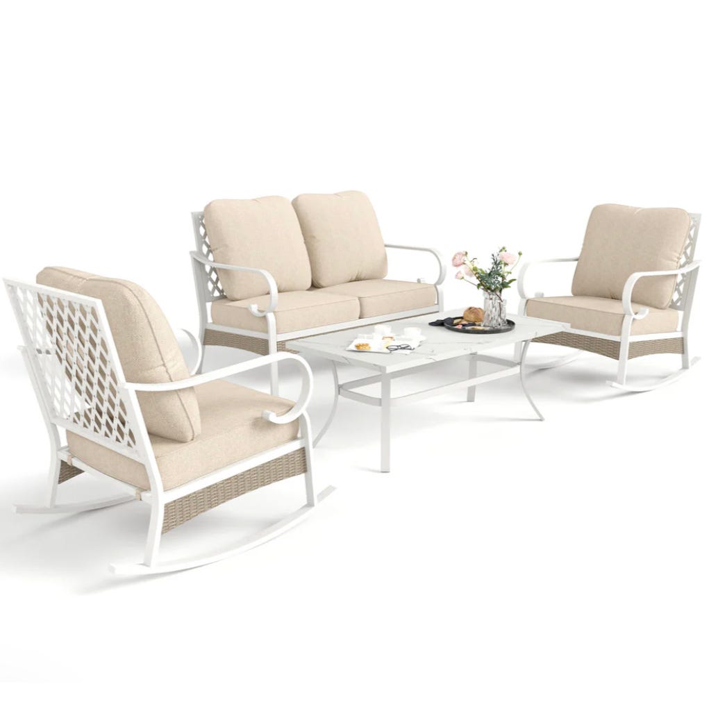 A patio set with a steel frame, featuring a two-seater sofa and two chairs with beige cushions, complemented by a rectangular coffee table with a glass top.