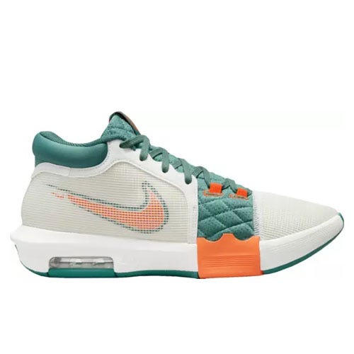 Green and white Nike basketball shoe with orange accents.