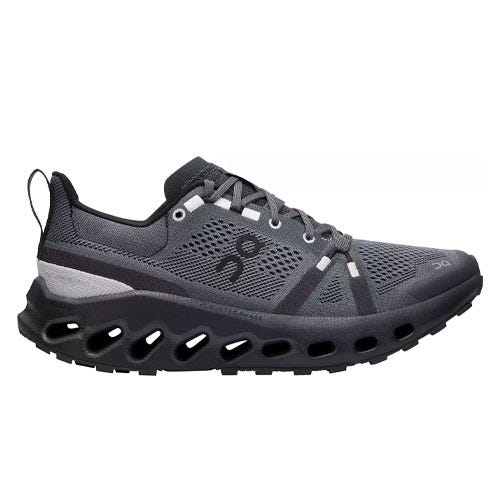 A gray athletic shoe featuring a mesh upper, reinforced eyelets, and a distinctive sole with cut-out sections for added ventilation and cushioning.