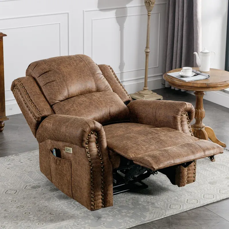 A brown upholstered reclining chair with extended footrest and brass stud detailing.