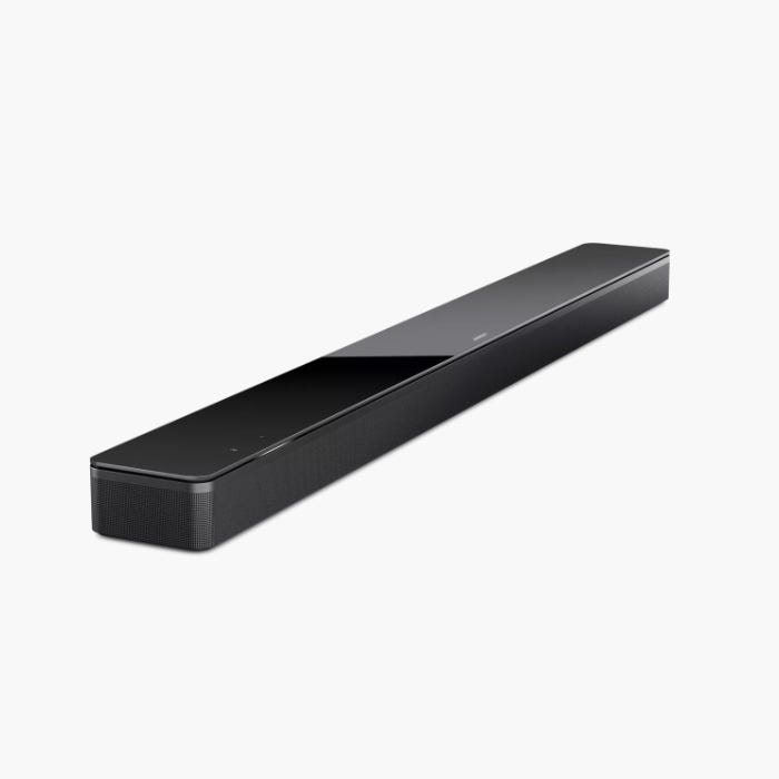 A sleek black soundbar with touch controls on the top.