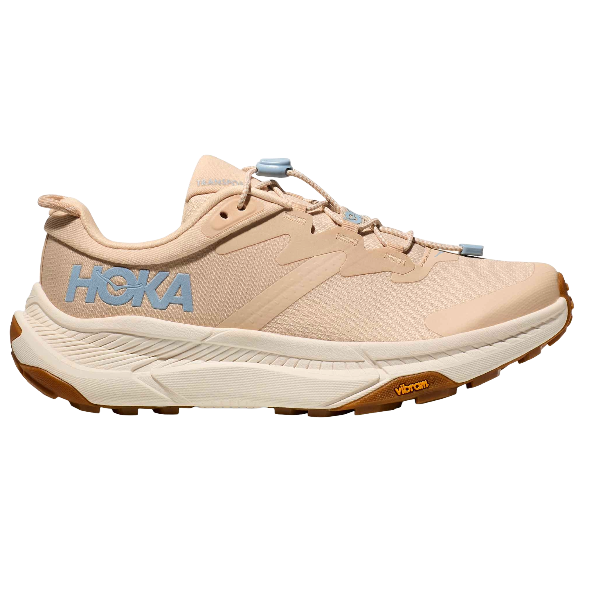 A beige Hoka sneaker featuring blue logo accents and a Vibram sole, designed for comfort and durability in various terrains.