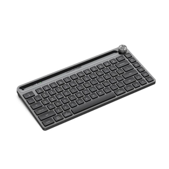 JLab Portable Mini Keyboard is a compact, wireless keyboard with low-profile keys and an integrated knob for easy control. Designed for portability, it has a slim layout, making it ideal for travel and small workspaces.