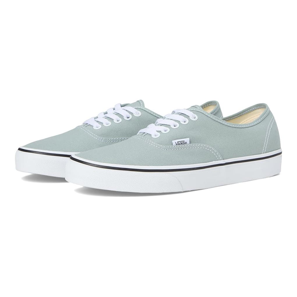 Vans Authentic Sneakers in light green feature a low-top design with a canvas upper, white laces, and a rubber sole with a black stripe. The classic silhouette is simple and versatile for casual wear.