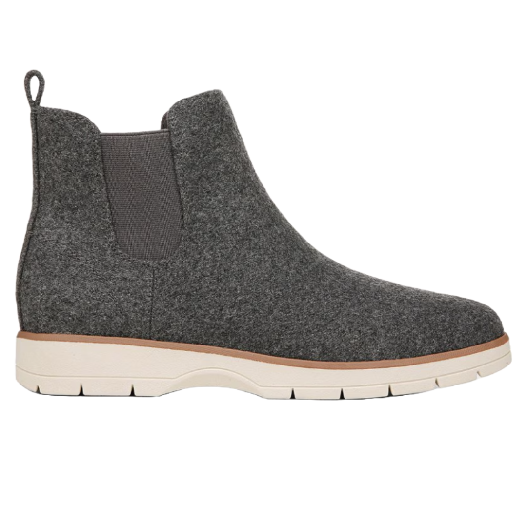 Dr. Scholl's Chelsea Boots feature a gray felt upper with elastic side panels, a pull-tab at the back, and a white textured sole for comfort and style.