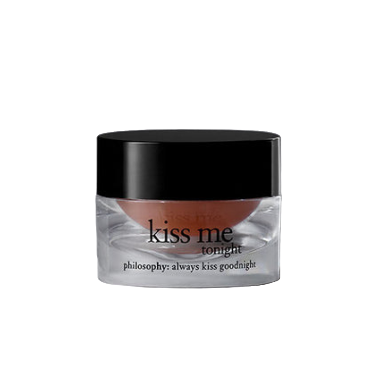 Kiss Me Tonight Lip Balm by Philosophy is a hydrating balm in a clear jar with a black lid. It features the text \“kiss me tonight\“ and \“philosophy: always kiss goodnight\“ on its label.