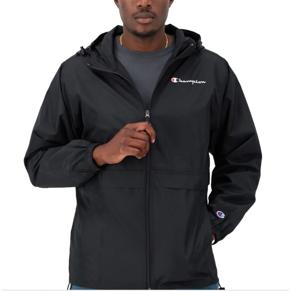 Champion Men's Hooded Jacket in black with a zip-up front, adjustable hood, and elastic cuffs. Features the Champion logo on the chest and sleeve, offering a casual and sporty look.