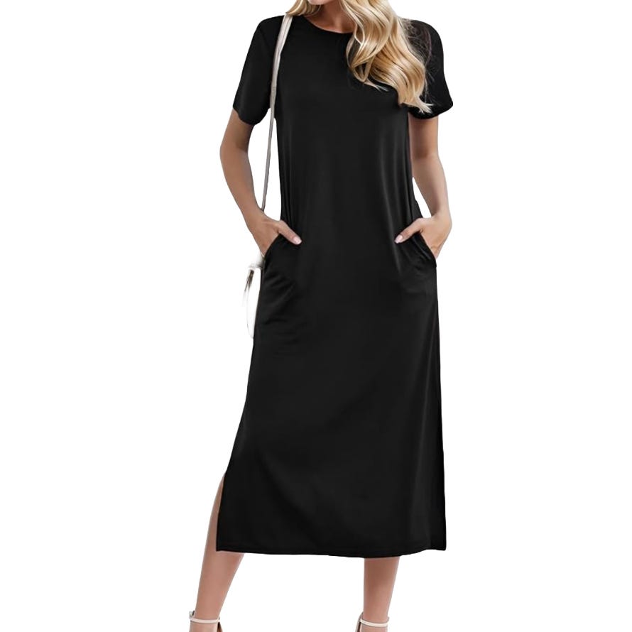 Black short-sleeve midi dress with side pockets, worn by a person carrying a white shoulder bag and wearing white heels.