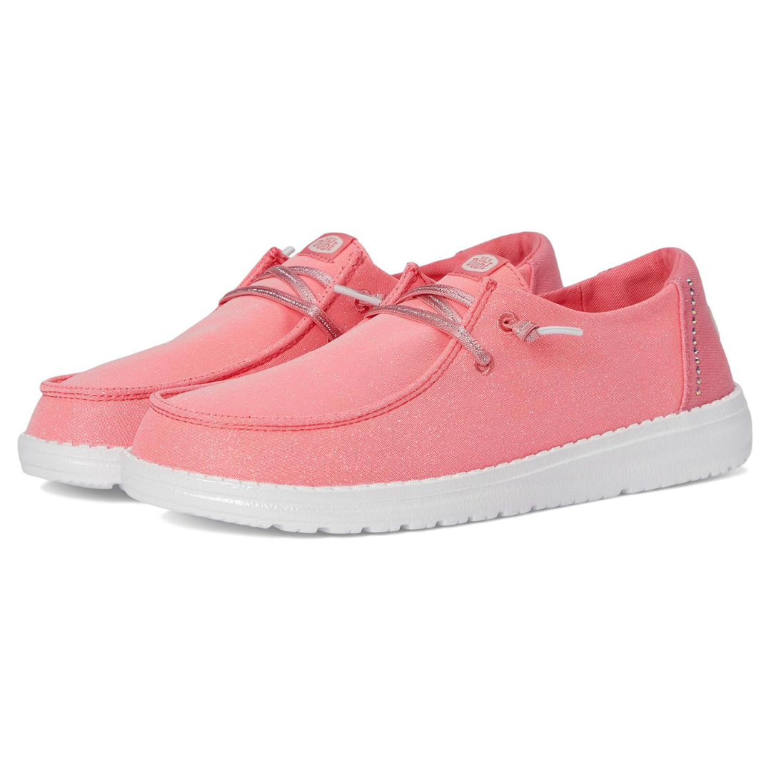 Pink casual shoes with glittery accents, featuring a low cut design, white soles, and metallic laces.