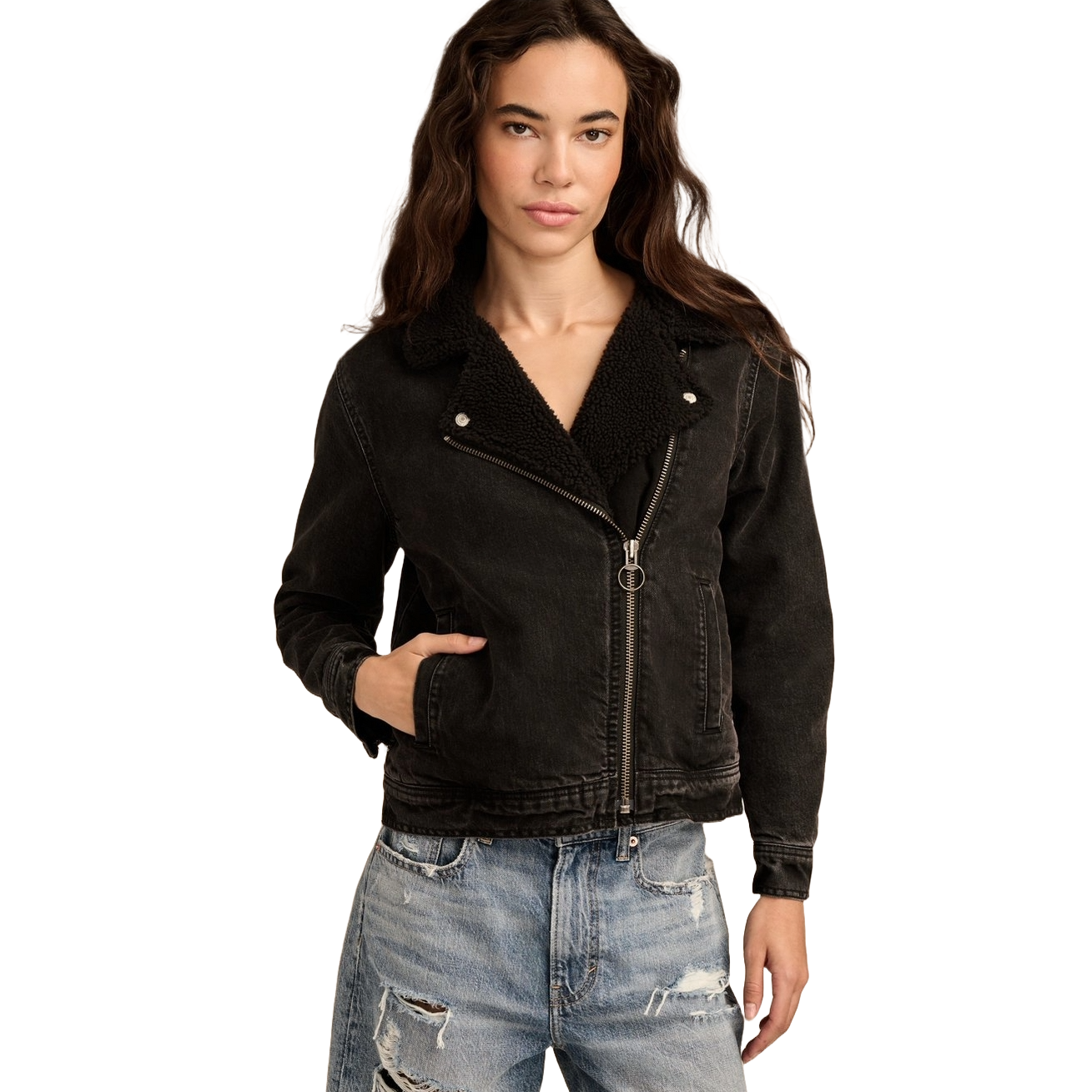 A black faux-shearling moto jacket featuring a zipper closure, wide lapels, and pockets, paired with distressed light blue jeans.