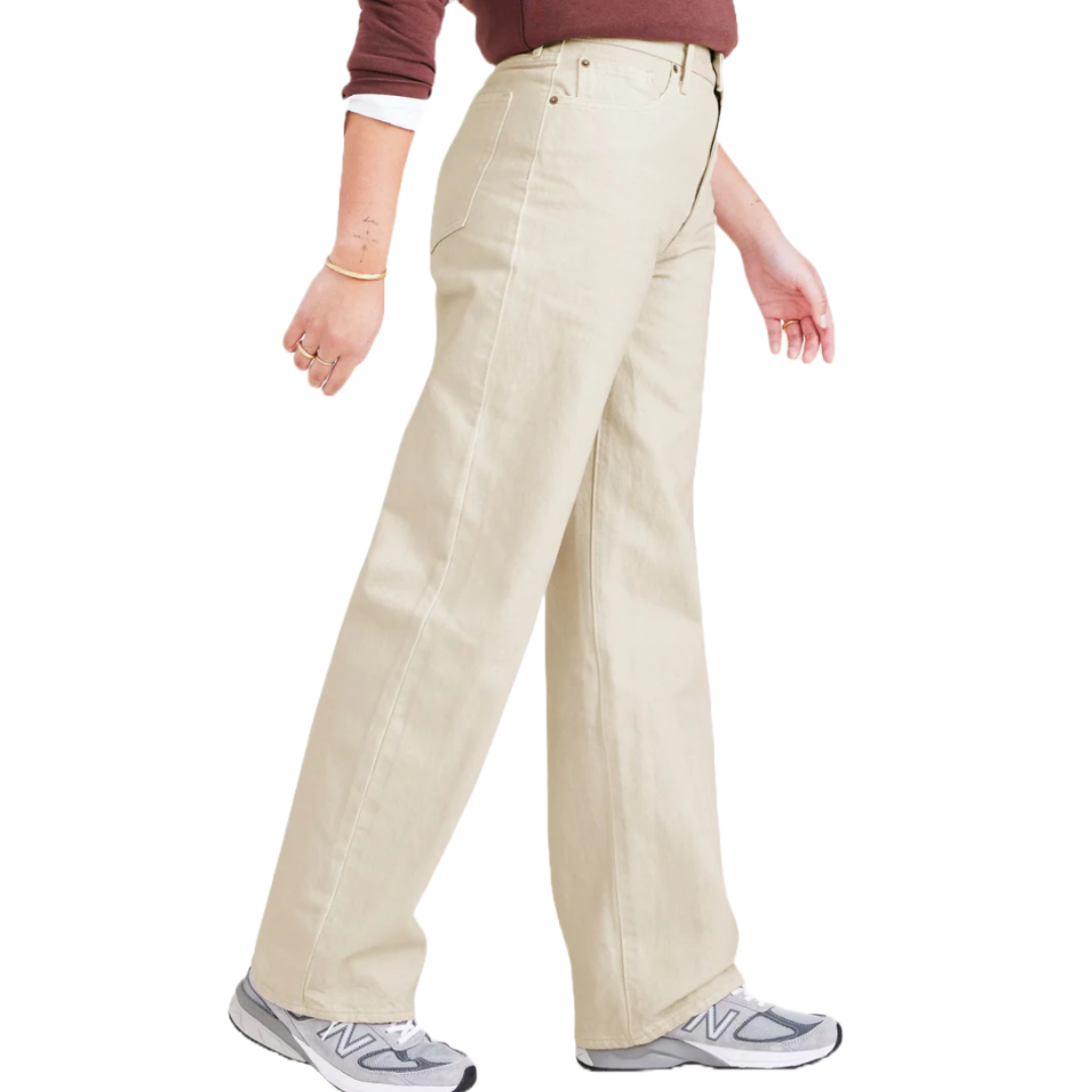 Beige high-waisted, wide-leg pants paired with gray sneakers and a maroon long-sleeve top.