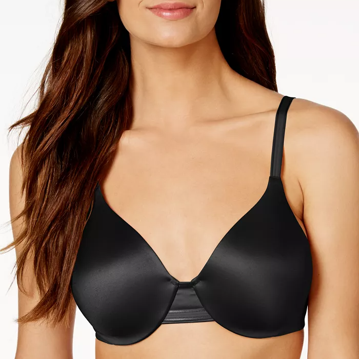 A woman wearing a black bra with adjustable straps.